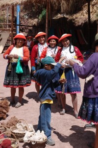 Ethan learning to spin wool with locals in Peru 